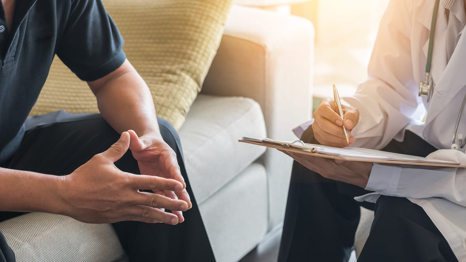 Man speaking with a doctor in an office about treatment resistant depression to explore other options besides medication.