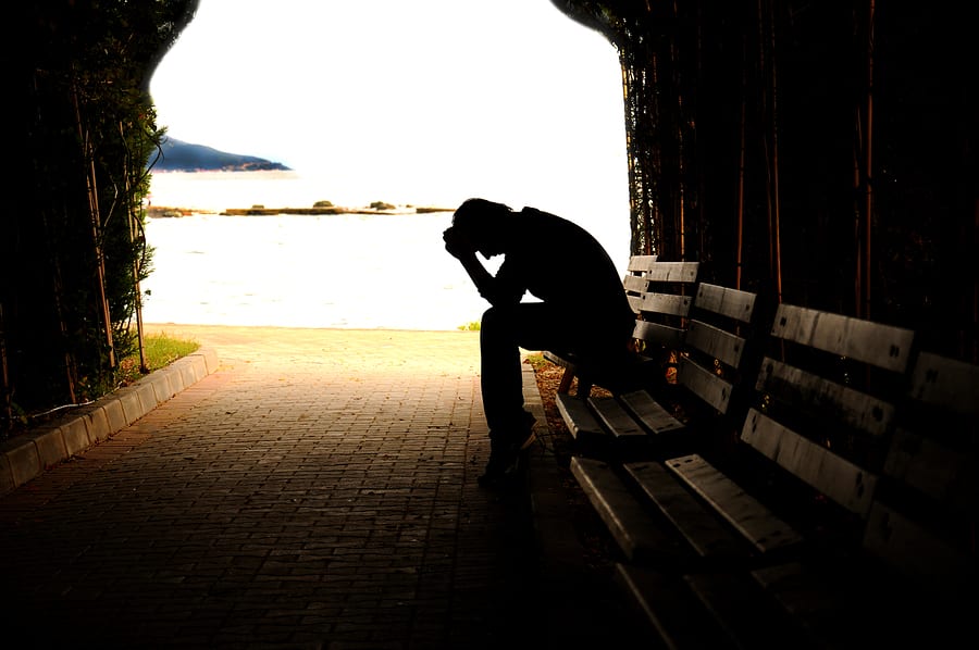 person on bench depressed