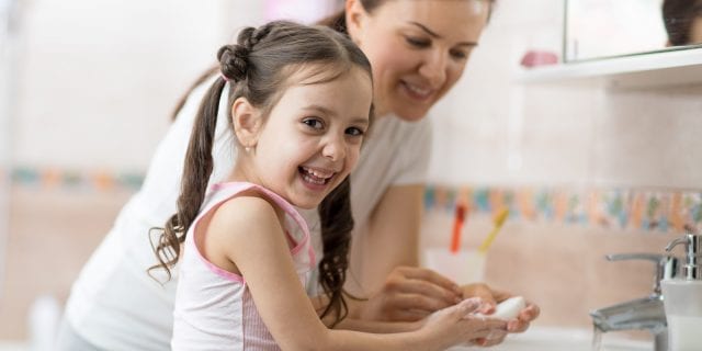 Mother and Daughter washing their hands