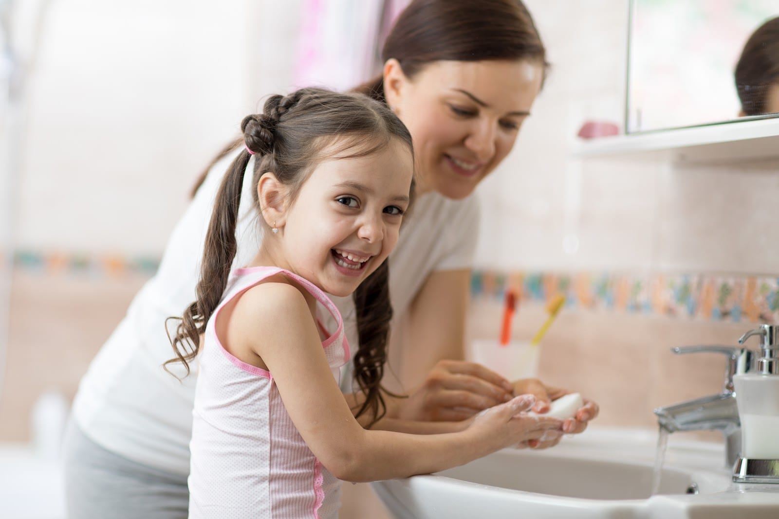 Mother and Daughter washing their hands