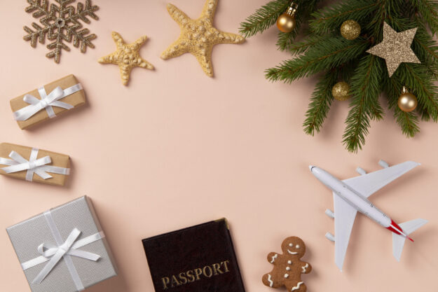 christmas-travel-concept-with-airplane Travel during the holiday season can be stressful, but the right preparations can help to make it bearable! Image by FreePik
