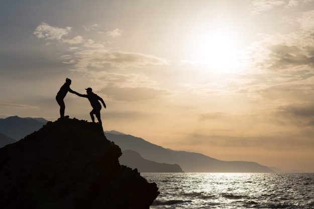 Helping Hand cliff sea people